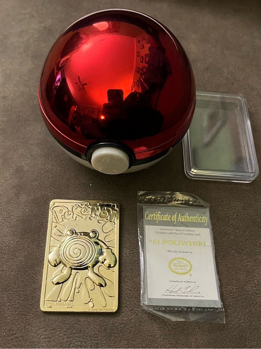 Red Poké Ball Display Case with Gold Poliwag Collectible Card #61
